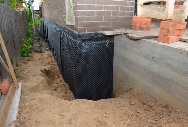 Happy homeowners after waterproofing job in Carbon Hill